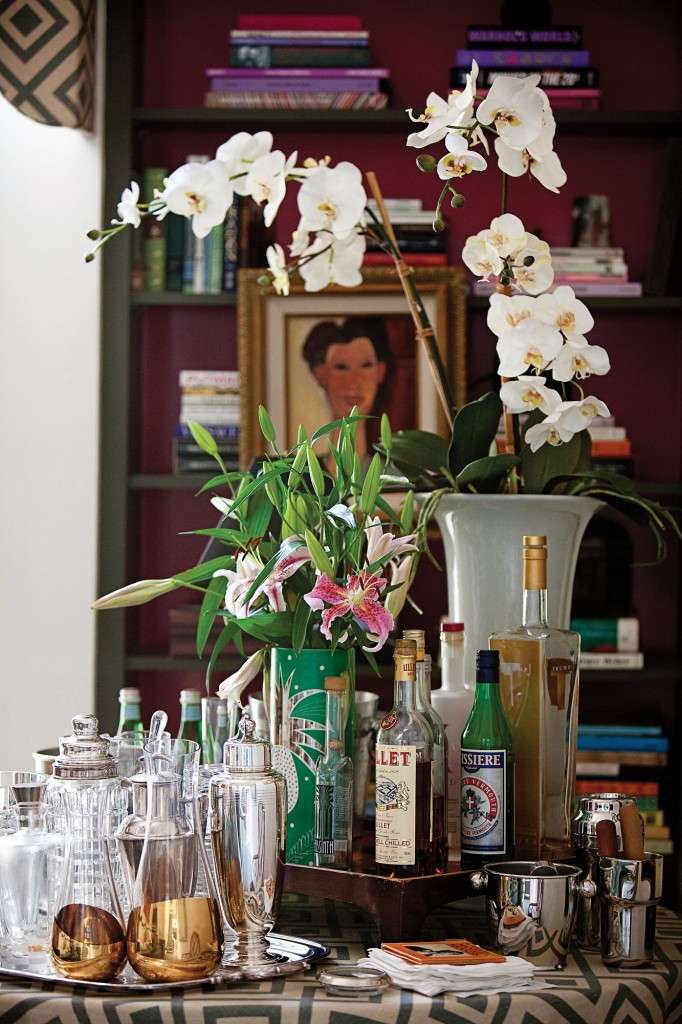 A drinks bar stands ready in the library. Table is draped with David Hicks' La Florentina.  