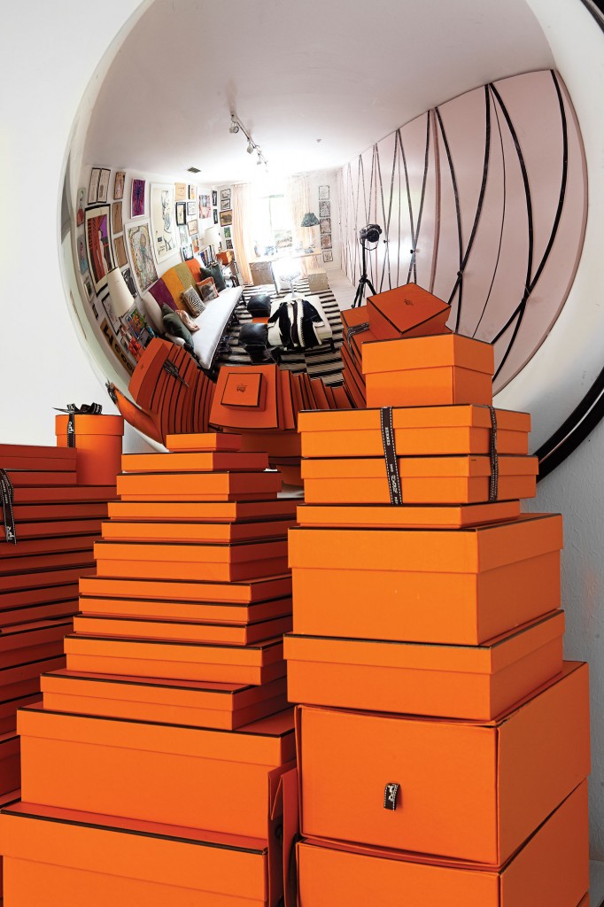 A mirrored half-dome from the ’70s came from Uncommon Objects in Austin and reflects a massive collection of Hermes boxes.
