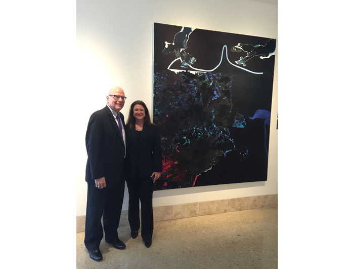 Museum director Joe Schenk and gallerist Deborah Colton, committee chair of the Houston Fine Art Fair, with a  classic canvas, recently restored. The museum will mount a special Hood pavilion at the Fair.