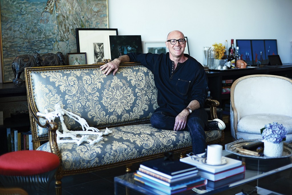 Dailey lounges on a 19th-century settee covered in vintage linen, with a FriendDoll from Ely Sellers. Side chair, one of a pair that he found and had stripped and covered in blonde teddy-bear fur. Books include "Lucha Loco" by Malcolm Venville and "The Secret Lives of Men and Women" compiled by Frank Warren.