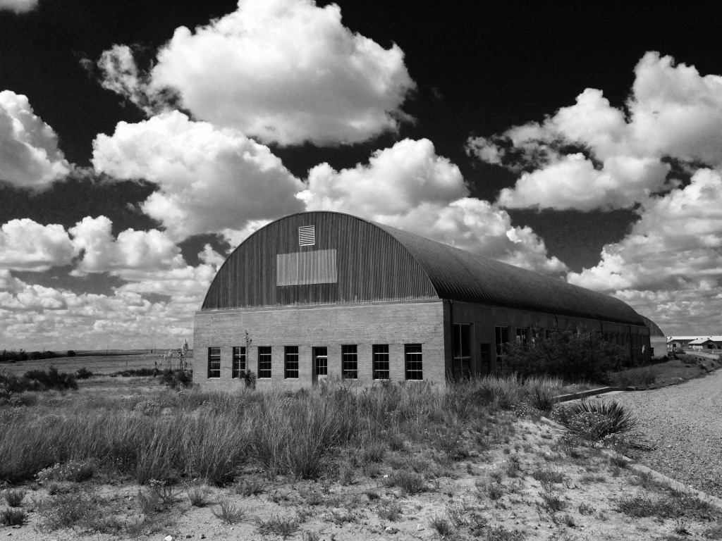 Hangar-like building at the Chinati Foundation and an endless view of perfect clouds
