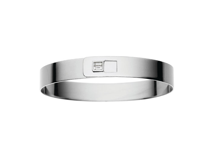Simple yet exquisite, the 18-karat cuff with a diamond baguette closure is perfect for a polished, minimalistic look.  