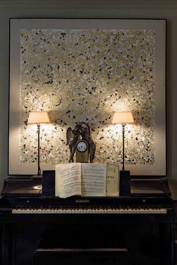 The antique piano was a gift from Parker’s mother when she was six. Contemporary art from Krispen. French clock, circa 1850.