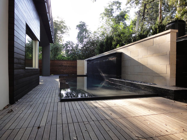 An infinity edge pool is part of the MASA Studio Architects home. 