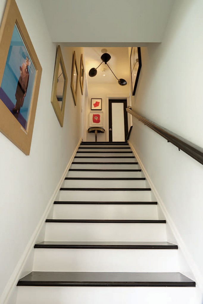 Art in the stairwell includes works by Robert Motherwell and Ellsworth Kelly. Serge Mouille three-arm ceiling fixture, circa 1950.