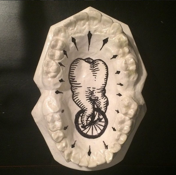 Jesus A. Castaneda (@exoskeletal27) is presenting his first solo exhibition, Extracted Manifestations, at the Division 9 Gallery in Riverside, California. His work is often composed of paintings or statues that depict teeth, evoking the human condition.