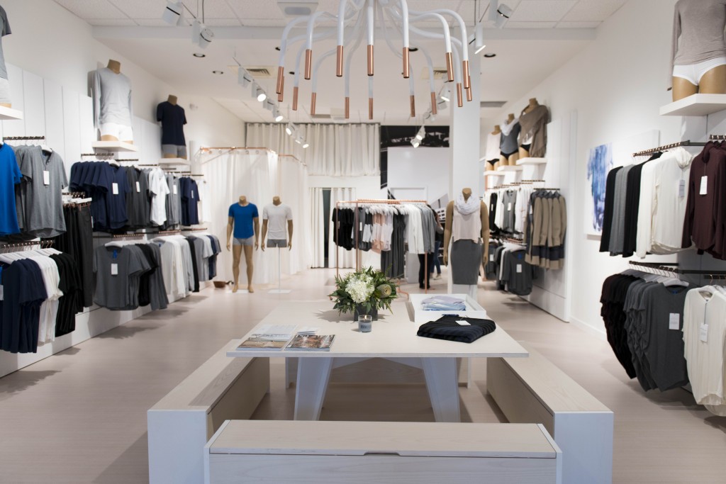 Kit and Ace's entrance features a light fixture by New Living. 