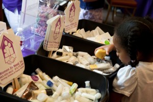 Kids Give volunteers assemble care kits for victims of domestic violence.