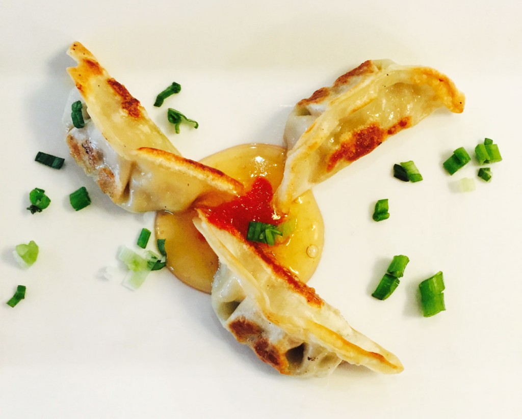 The Chinese pot stickers at White Oak Kitchen + Drinks are stuffed with vegetables and served with a spicy plum sauce. 