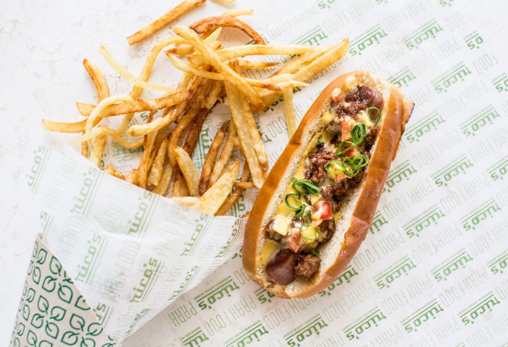 Rico's Tex Mex Dog — grilled all-beef hot dog, chile con queso, guacamole and pickled jalapeños.