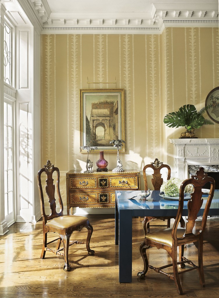 To center a dining room in a 19th-century house, a Karl Springer table from the 1970s was lacquered blue and paired with a set of Portuguese chairs. (Photography by Pieter Estersohn)