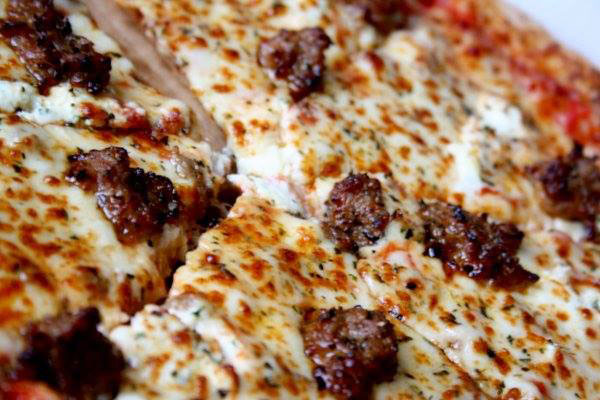 Pink's serves 10-inch thin-crust pizza slices. (Photo courtesy Pink's Pizza's Facebook page)