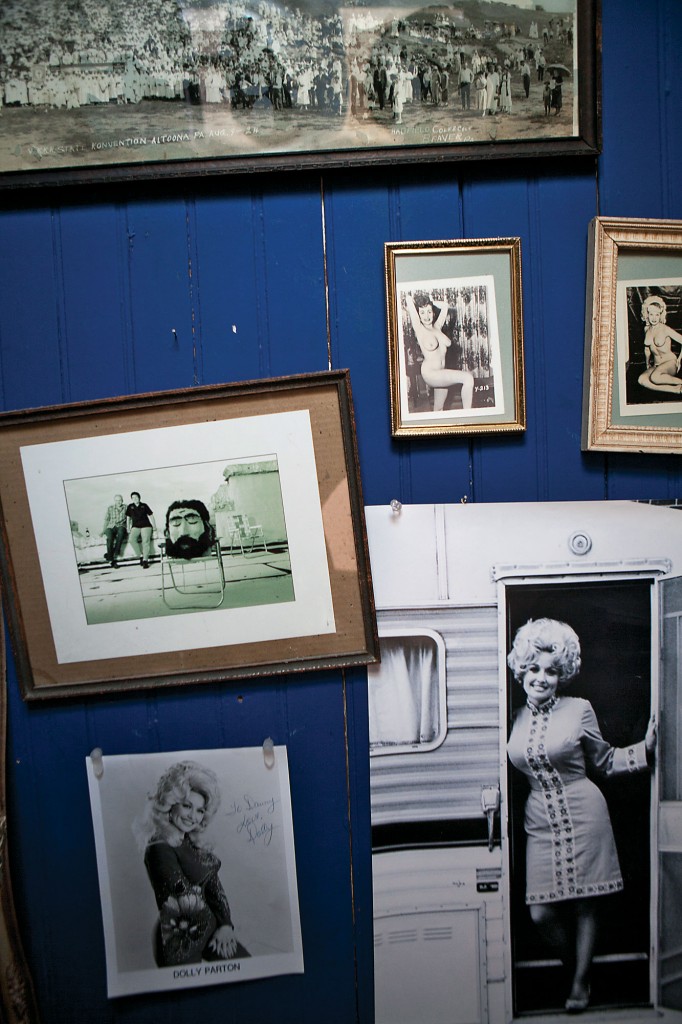 Bathroom stall wall boasting
an early photo of Dolly.