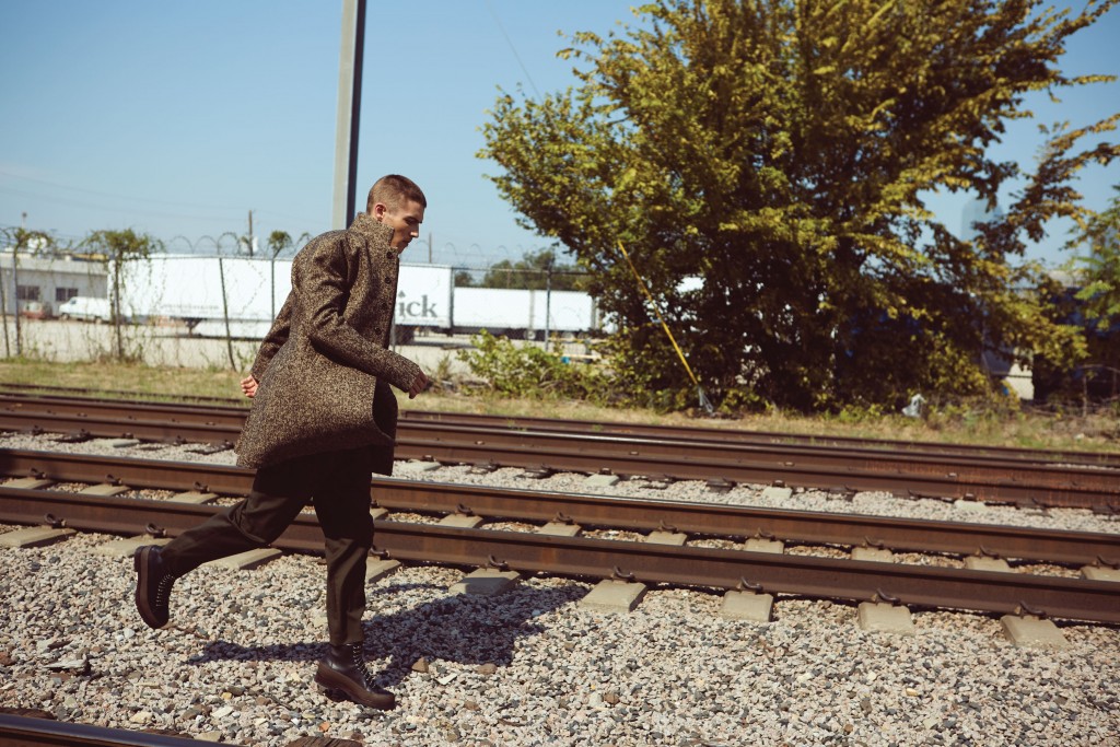 John Varvatos button-front coat $1,898, at the John Varvatos boutique, Neiman Marcus. 3.1 Phillip Lim pleated trouser with belt $450, and Summit short boot $550, both at 31philliplim.com.
