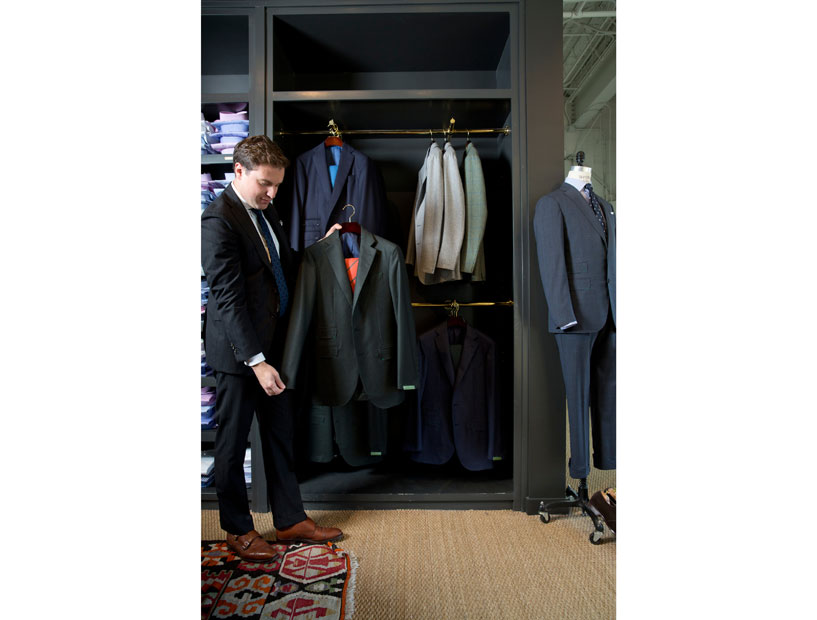 Justin Leitch admires his stylish gift pick — the flannel suit. 