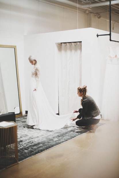 A & Bé stylist Ashtyn
Stringer assists a
bride during her fitting. Wedding dresses are different at this store.