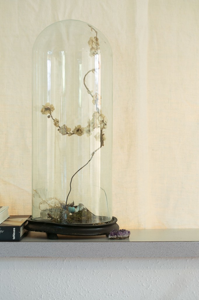 Victorian cloche from
August Antiques holds
a wire branch with
millinery flowers.