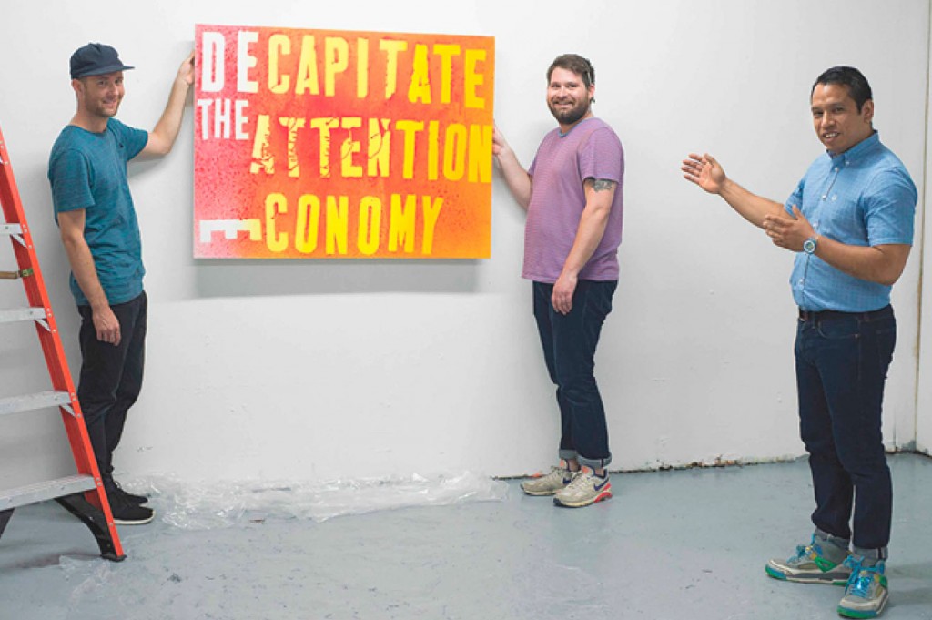 Pablo Cardoza (far right), one of the new gallerist power players, and his posse, install a Mark Flood show. Left to right: Artists Alika Herreshoff and Lane Hagood with Cardoza. (Photo Auliya Flory)