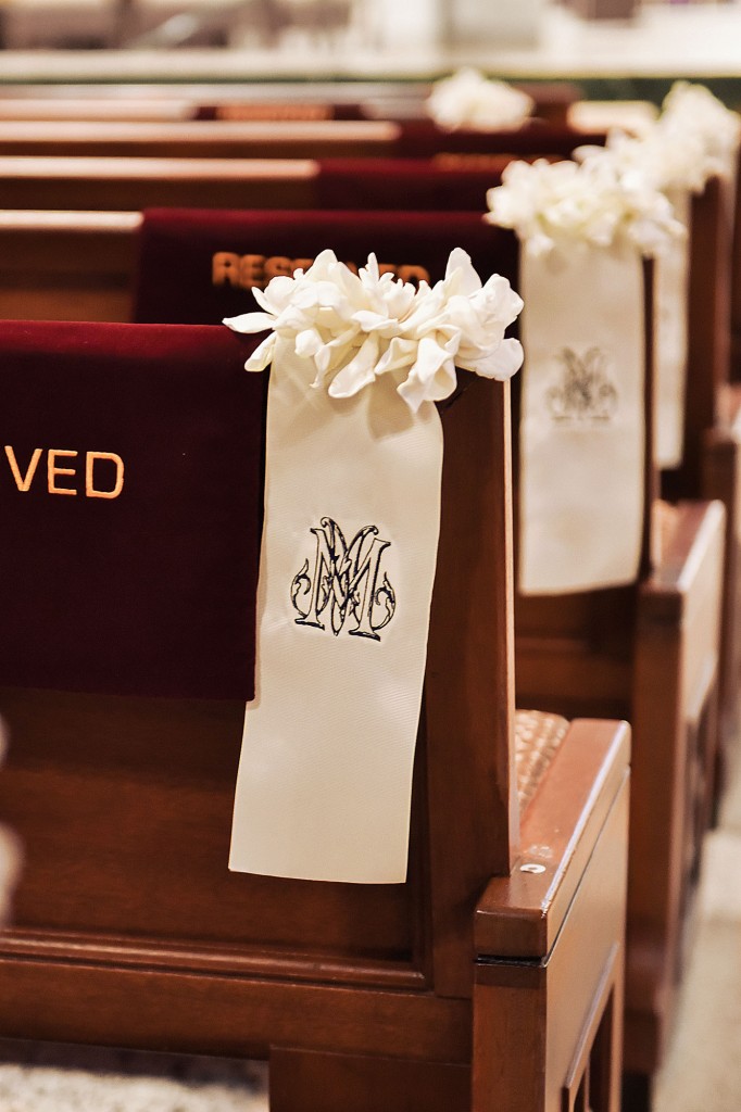 Custom monograms hung on the pews of St. Michael Catholic Church. 