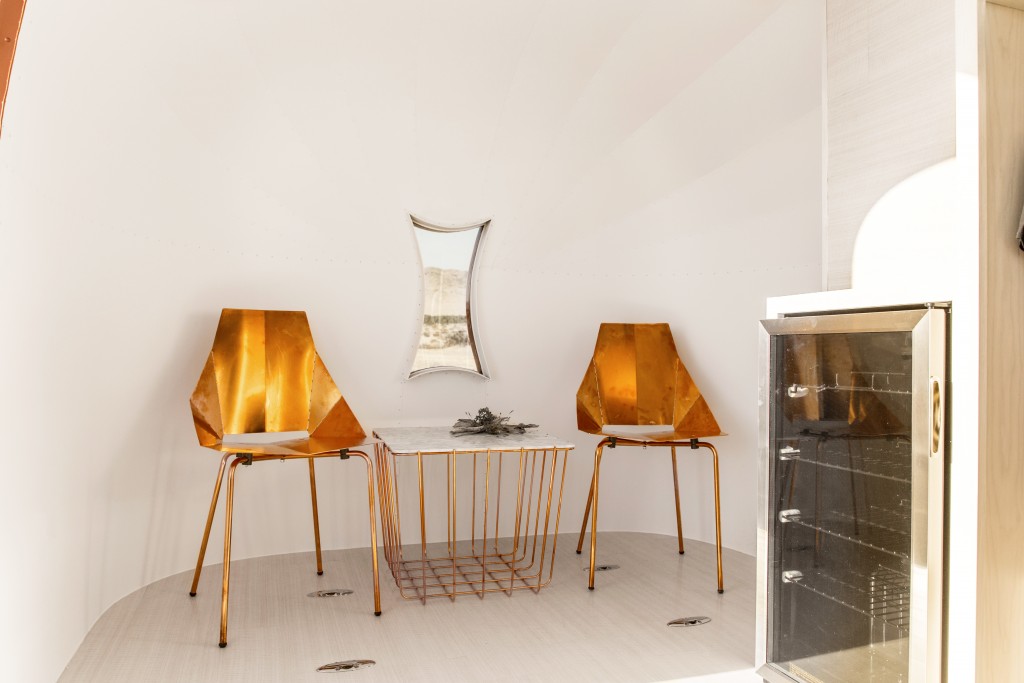 Modern furniture brand Blu Dot copper chairs and a cage table for the mobile showroom. 