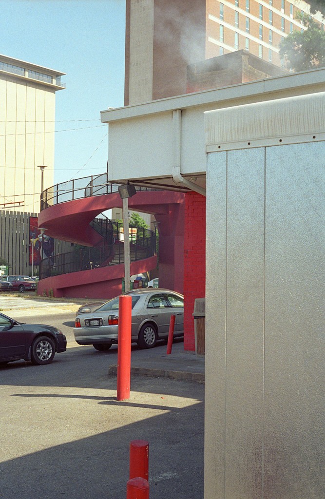 Akin captured the facade of Tops B-B-Q in Memphis, where he obtained a jumbo chopped fine sandwich to take as an offering to Eggleston.