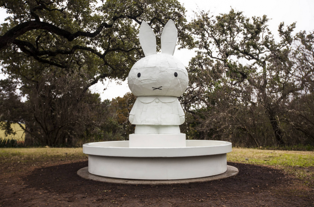 Tom Sachs’ “Miffy Fountain,” 2008, formed from silicon, bronze and paint stands nearly 12 feet high. Shown as installed at The Contemporary Austin’s Betty and Edward Marcus Sculpture Park at Laguna Gloria, 2015. Courtesy Tom Sachs Studio. Photo Brian Fitzsimmons.