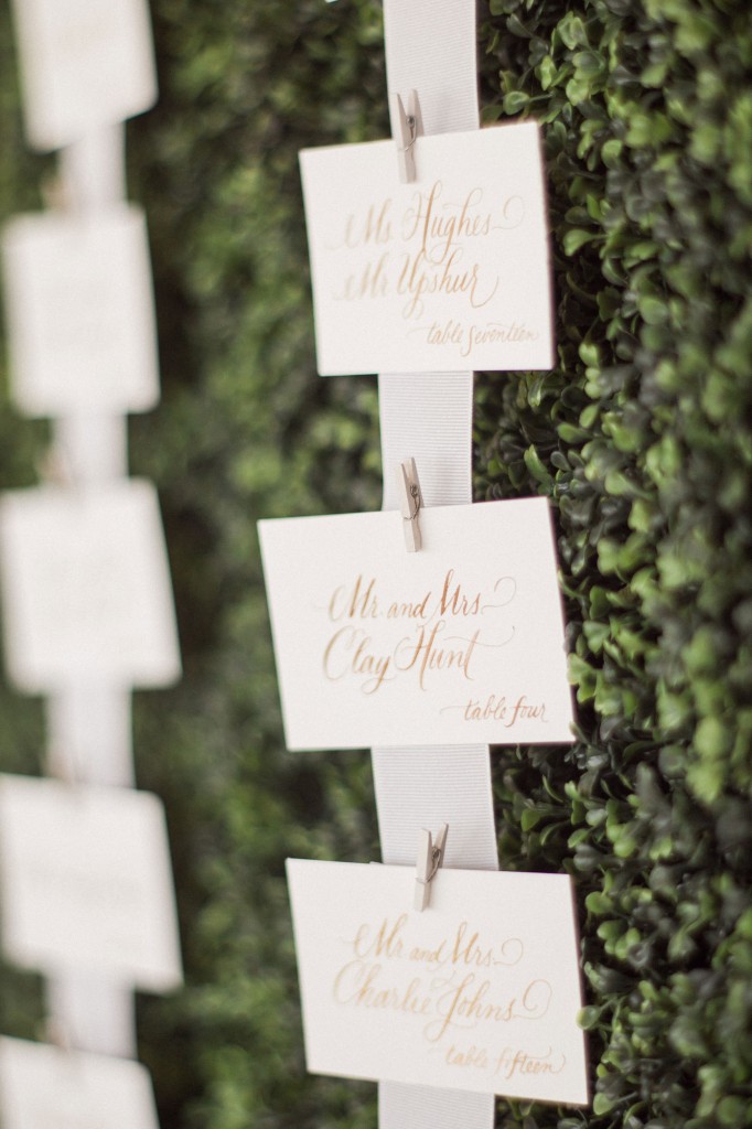 Elegant calligraphy by Lolo Lincoln and a simple hedge-wall made for the perfect place-card design.