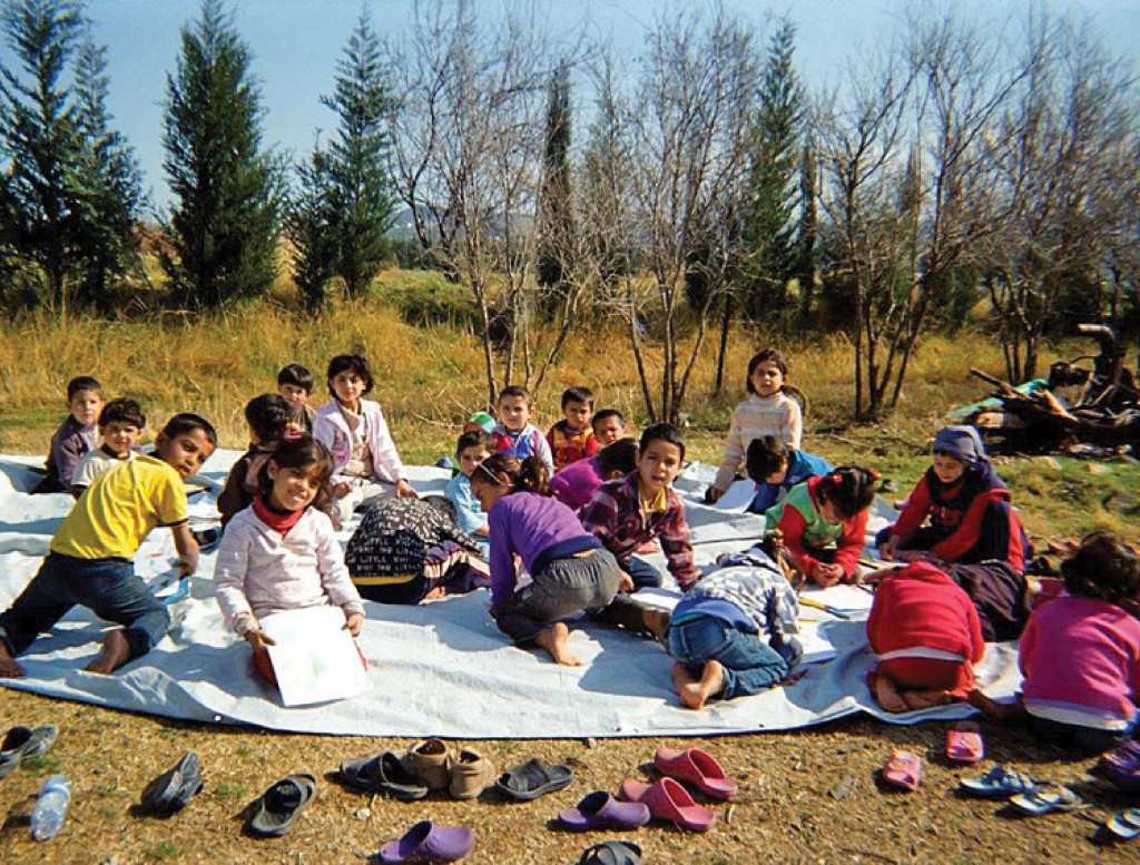 Refugee children at their school. (Courtesy UNICEF)
