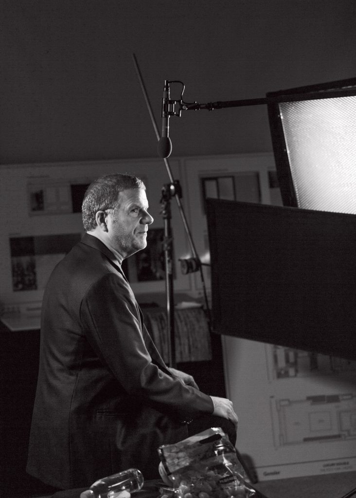 Tilman Feritta does touch-ups for his new TV show. (Photo by Max Burkhalter)