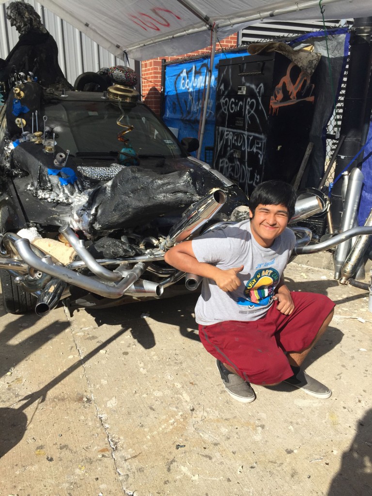 Posing with the hood of "Bohemian Rhapsody," a former 1993 Nissan Sentra.