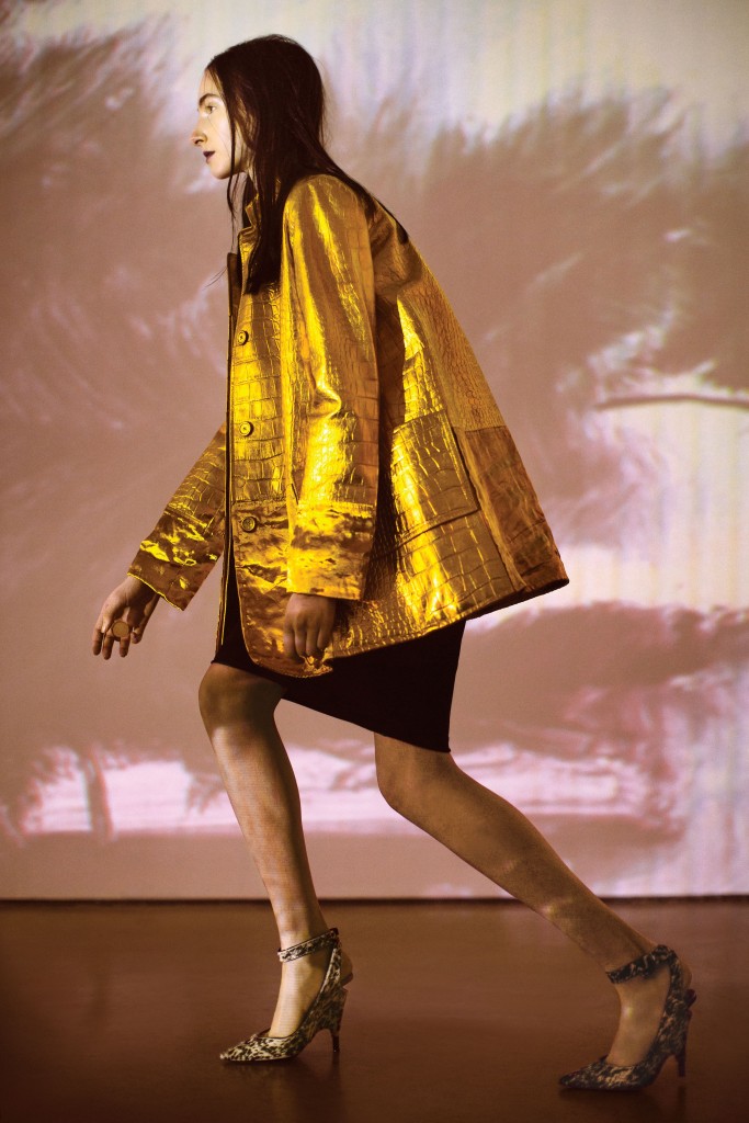 Tom Ford croc-embossed coat $7,450, silk jersey T-shirt dress $1,590, and ankle-strap
pump $1,690, all at the Tom Ford boutique, Neiman Marcus. Artwork: Joey Fauerso’s single-channel video "Guadalupe — After Images," 2014, at David Shelton Gallery, Houston.