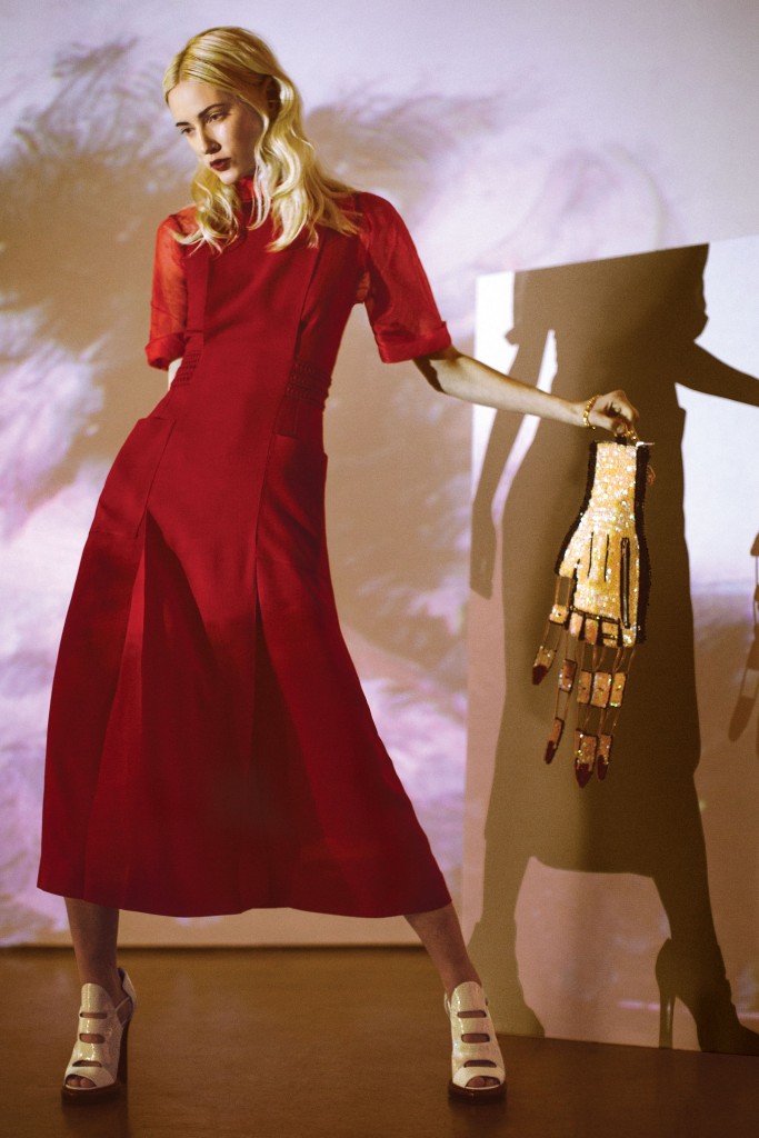 Fendi dress $2,400, silk-blend top, price upon request, and leather booties $1,150, all at the Fendi boutique, Neiman Marcus, Saks Fifth Avenue, Tootsies. Cut Off Fingers clutch $275, at discountuniverse.com.au. Artwork: Joey Fauerso’s single-channel video "Guadalupe — After Images," 2014, at David Shelton Gallery, Houston.