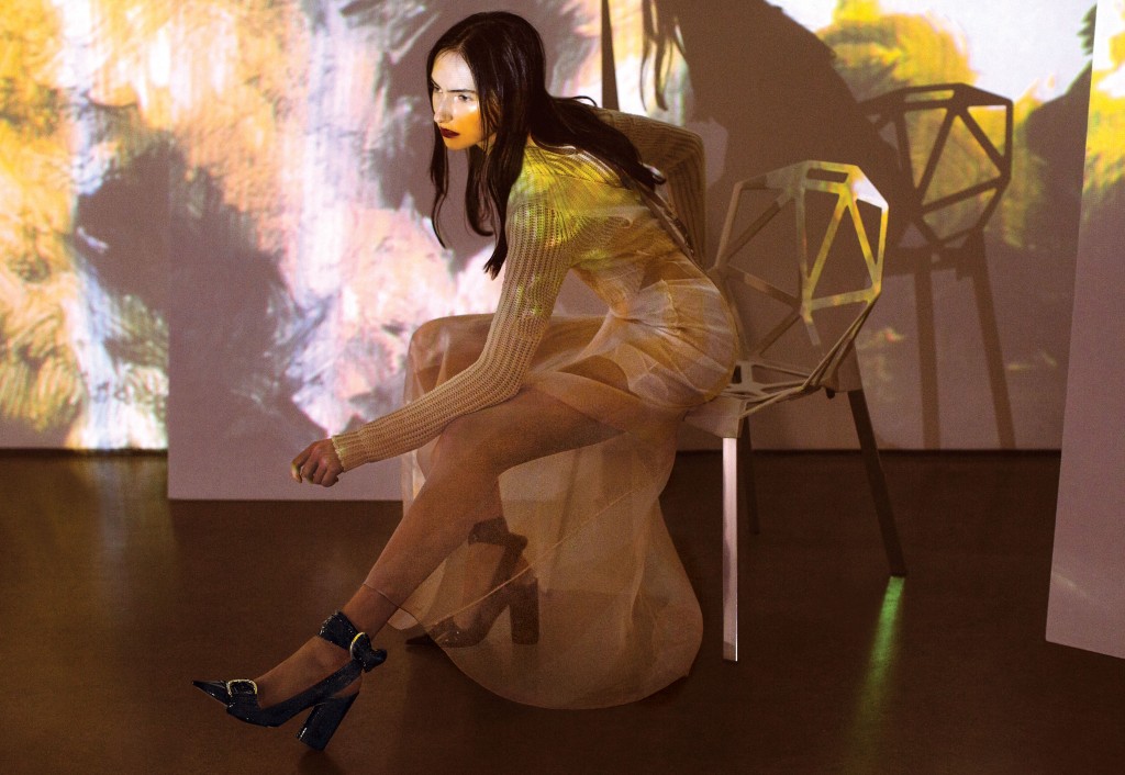 Christian Dior cotton voile shorts (sold as set with top) $2,200, wool sweater $1,300, silk organza dress $10,500, and patent-leather slingback pump $1,100, all at the Christian Dior boutique, Saks Fifth Avenue, Tootsies, The Webster. Artwork: Joey Fauerso’s single-channel video "Guadalupe — After Images," 2014, at David Shelton Gallery, Houston.