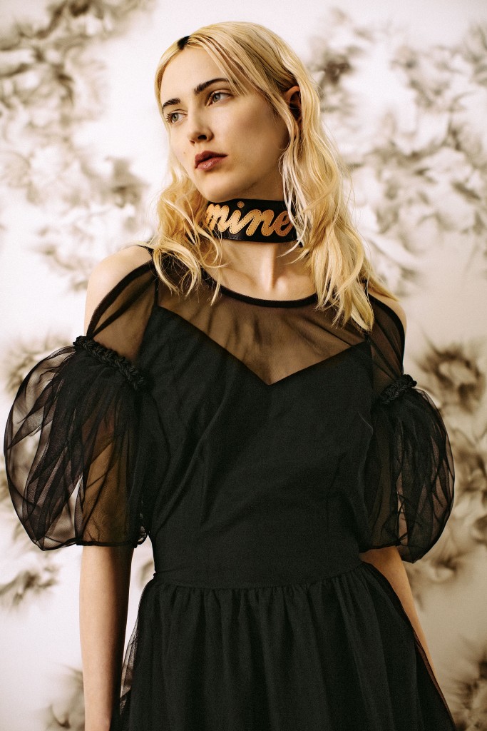 Simone Rocha sheer tulle apron dress with slip $1,320, at Laboratoria, Neiman Marcus. Zana Bayne Mine
choker $150, at zanabayne.com. Artwork: Matthew Satz’s "Tar and Feather / Smoke Painting (Diptych)," 2016, at Barbara Davis Gallery, Houston.