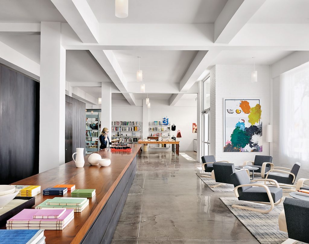 The lobby check-in counter is crafted in mahogany by Joey Benton of Silla. Original beams and coffers from the 1929 building. Alvar Alto Tank chairs. Painting by Jeff Elrod.