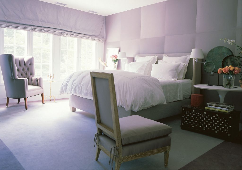 A bedroom encased in watery tones