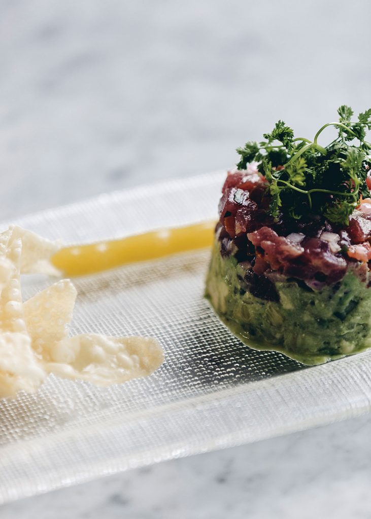 Toulouse's tartare de thon is composed of ahi tuna, spicy tomato relish, avocado, pineapple and a cucumber ginger passionfruit coulis.