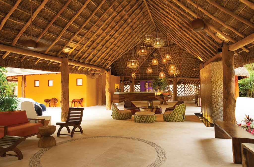 The open-air lobby boasts vibrant colors in a chic yet comfortable setting.