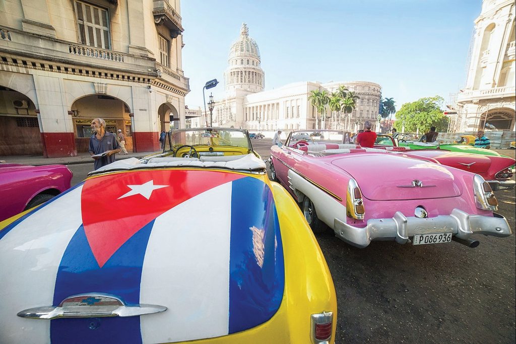 Vintage cars line the streets in Havana. 
