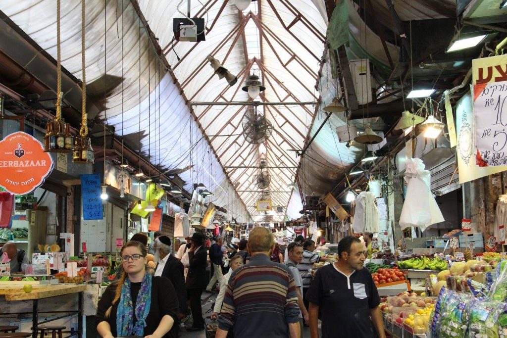 Bustling activity in the Mechane Yehudah marketplace. (Photo by Maddie Coughman)