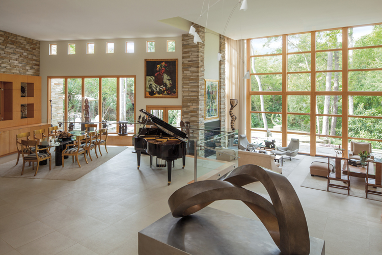 Andersen® E-Series casement and picture windows and hinged patio doors with pine interiors.