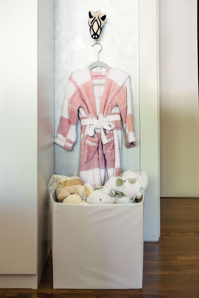 Hermès robe and plush toys are at Alicia's fingertips. 