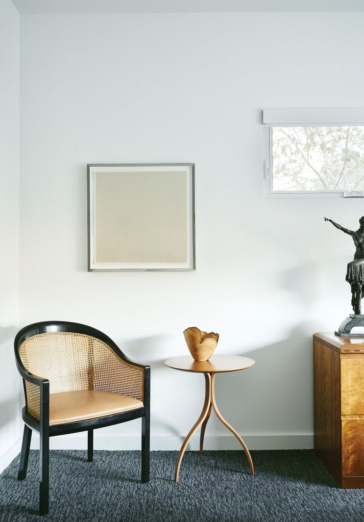 In the guest bedroom, Art Deco bronze sculpture by Demétre Chiparus. Shaker-style table and Ward Bennett chair, both vintage. Wood-turned vessel found in Alaska. Taipei carpet. Marfa artist Nick Terry’s Untitled.