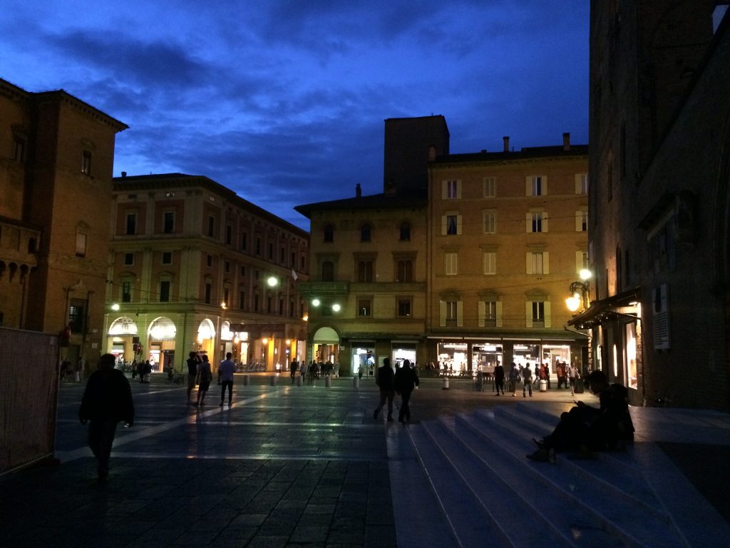 Nightime glow of Piazza Maggiore.