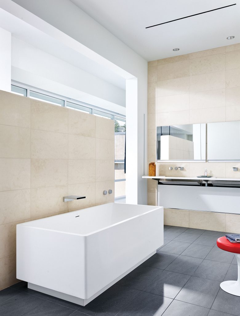 In the master bath, a resin tub by Blu Bathworks, Vancouver, and Caesarstone sink with hidden pipes from Australia. Dornbracht fixtures.