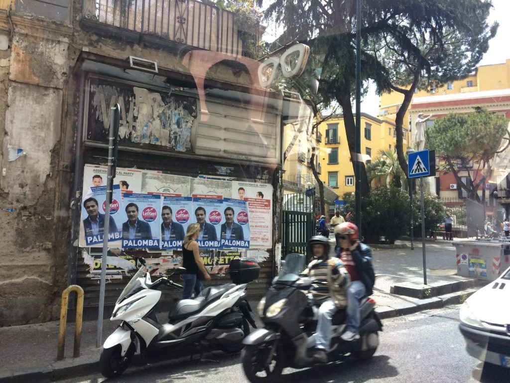 Naples gritty and strong street energy draws us in. 