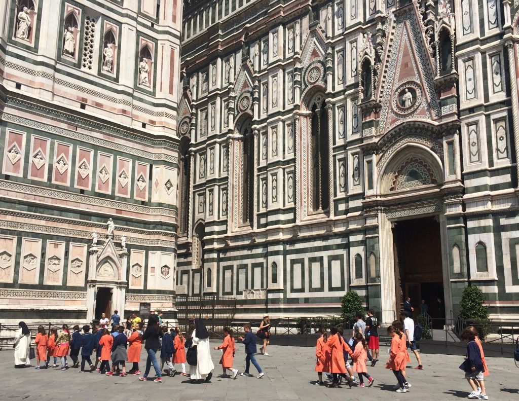 Field trip goers march past the Duomo in Florence.