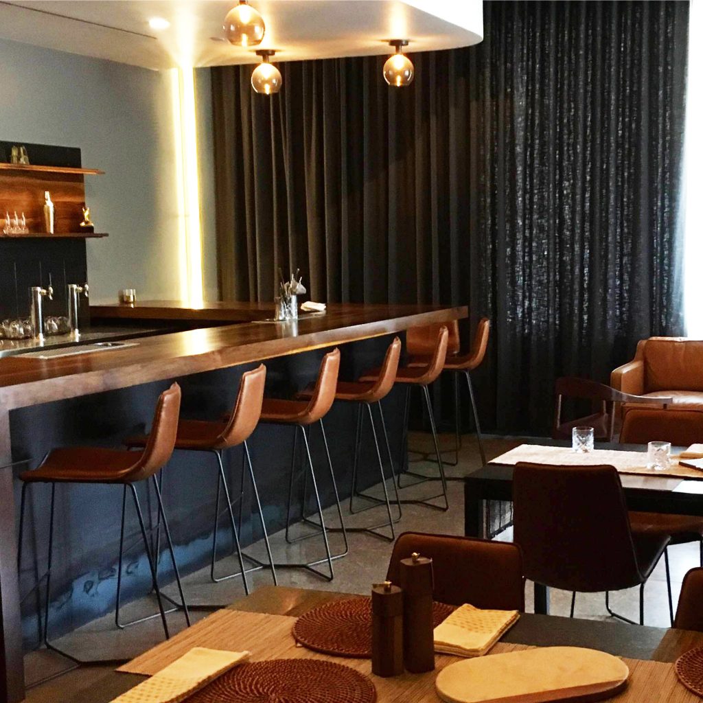 Jettison's design contrasts Houndstooth's light, airy design, with the addition of sharp, clean lines and a darker color palette. 