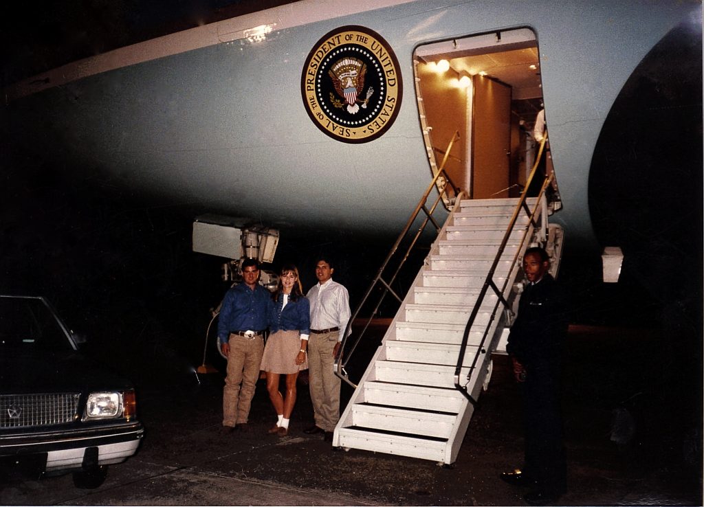 Roberto, Erica, and Raul Molina stand in front of Air Force One.