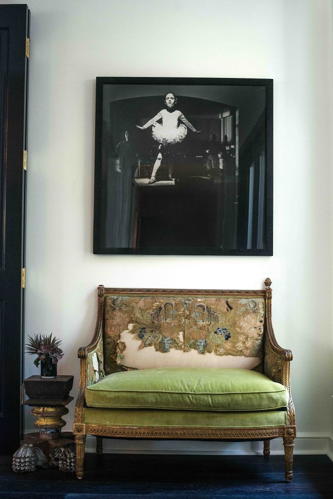 In the dining room, antique French settee with original upholstery; Nic Nicosia's "Real Pictures #6," 1991, from Lisa Brown Consulting